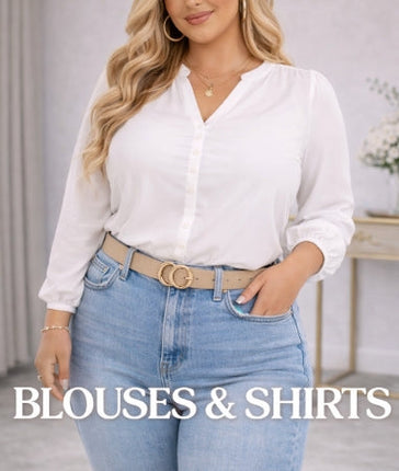 Plus size blonde woman wearing a white blouse styled with high waisted jeans in a neutral indoor setting