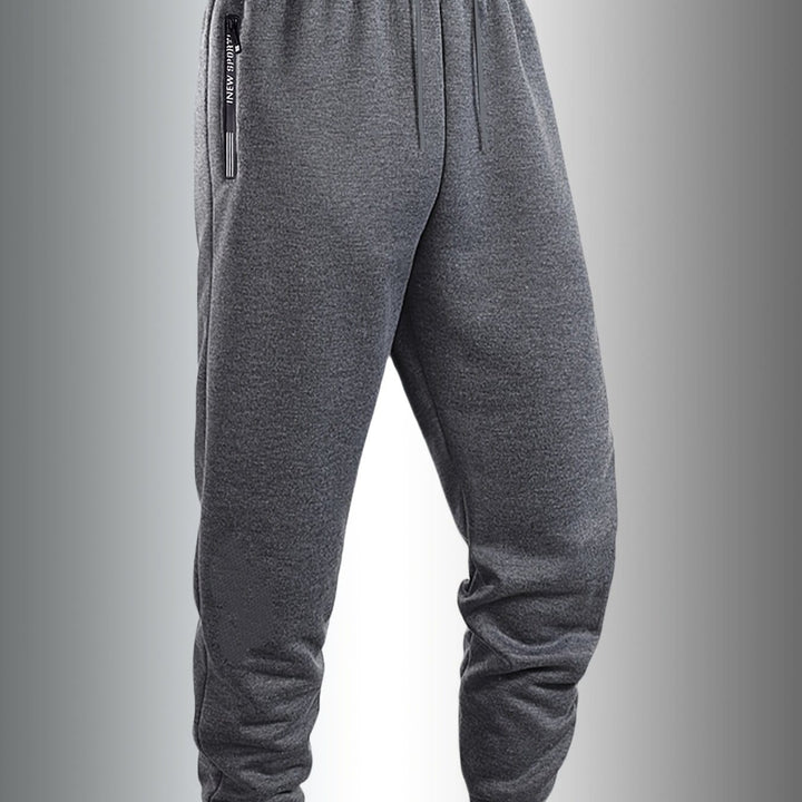 Men's Casual Sporty Cuffed Pants with Side Letter Zipper Pockets and Elastic Drawstring Waist, Trackpants Perfect for Year-round Wear. The Simple and Elegant Design Makes Them an Ideal Choice for Various Occasions, as Well as the Perfect Option